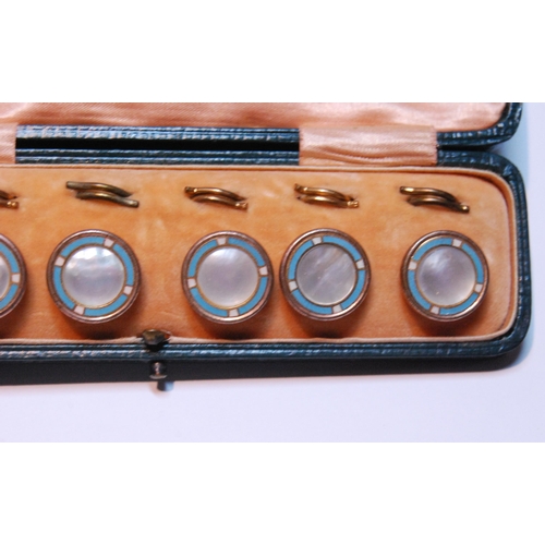 127 - Set of six blue enamel and mother of pearl dress studs, 1cm diameter, in fitted case.