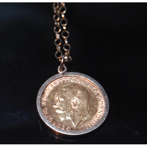 137 - George V gold half sovereign pendant, 1911, mounted on a 9ct gold chain, 6.6g gross.