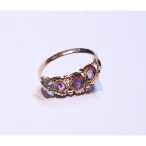 145 - 9ct gold amethyst three-stone ring set with three graduated amethysts, stamped '375', size P, 2g gro... 