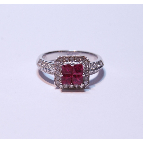 148 - 18ct white gold ruby and diamond ring set with four rubies, measuring in total .90ct, flanked by sma... 