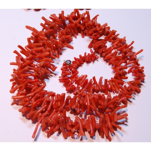 160 - Coral branch necklace of long form, 72.5cm long, and a string of coral-style beads with yellow metal... 