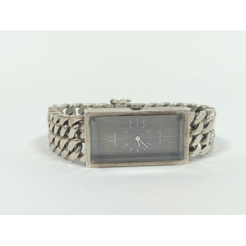 22 - Omega de Ville silver watch, the rectangular bronze dial on silver filed curb bracelet.