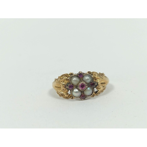 49 - Early Victorian garnet and pearl ring in engraved gold, probably 15ct, size 'N'.