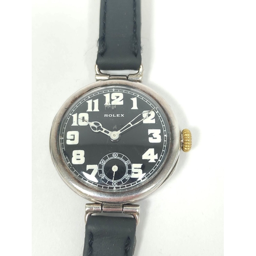 52 - Rolex silver watch of trench style, with white on black dial, Import Marks 1917, 34mm, on strap.