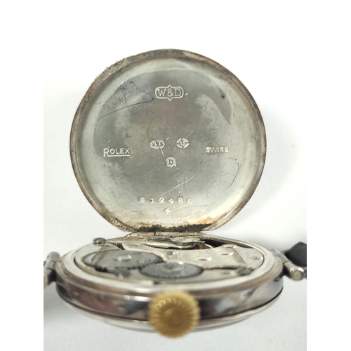 52 - Rolex silver watch of trench style, with white on black dial, Import Marks 1917, 34mm, on strap.