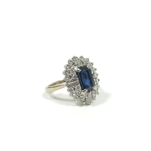 53 - Diamond and sapphire oval cluster ring with four tapering baguettes, two rows of brilliants and rect... 