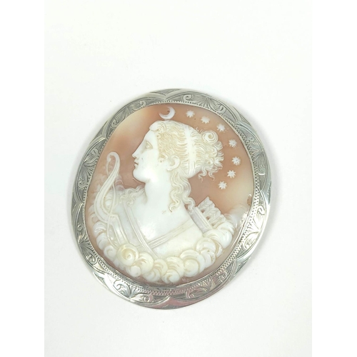 66 - Cameo brooch nicely carved featuring Diana with bow and arrows, engraved silver. C1880 55x49mm