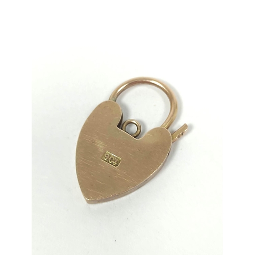 76 - 9ct gold padlock and two charms. 7g