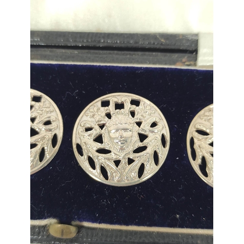 78 - Set of six silver pierced buttons by Liberty 1900, cased, and a silver compass.