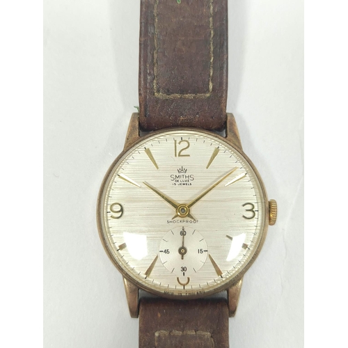 82 - Smiths de Luxe 9ct gold watch inscribed and dated 'British Railways W L Wright' on strap 1962. 31mm.