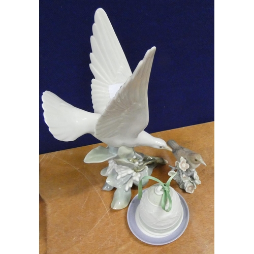 43 - Two Lladro bird figures, a Lladro dish and another bell. (3).