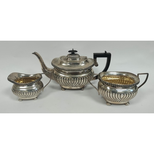 21 - Silver three piece tea set of fluted boat shape by Sheffield 1904. 1190g./38oz approx.