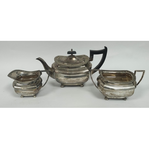 25 - Silver three-piece tea set of rounded rectangular shape, Walker & Hall Sheffield 1931. 1304g / 4... 