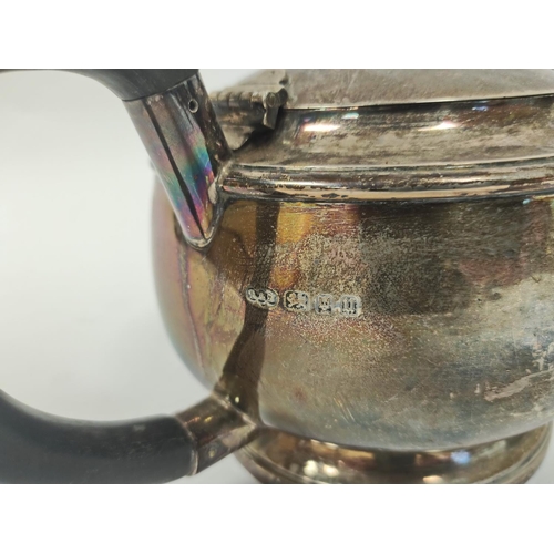 26 - Silver tea pot of plain compressed spherical shape by Reid & Sons 1935, 688 grams.