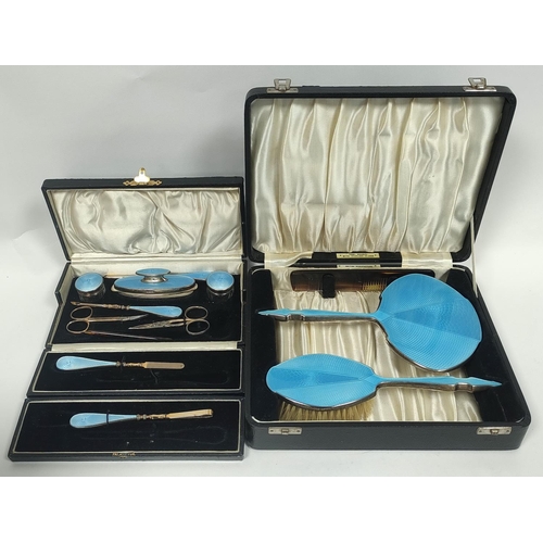 79 - Silver hairbrush and mirror with guilloche enamel, 1936 and a similar manicure set, both cased.