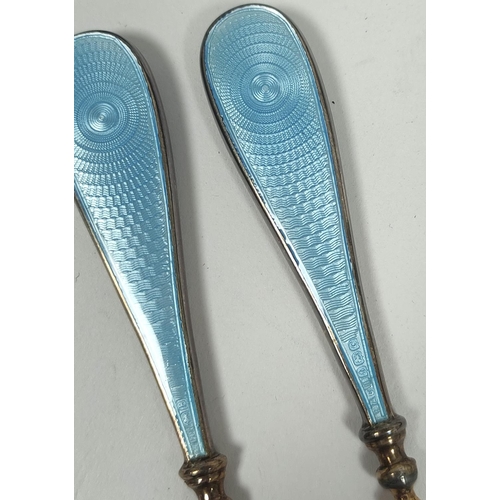 79 - Silver hairbrush and mirror with guilloche enamel, 1936 and a similar manicure set, both cased.