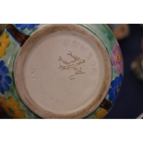 116 - Mettana jug with Clarice Cliff style decoration, and a drip-glazed blue ground vase.