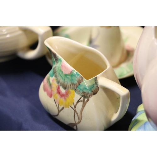 34 - Clarice Cliff Lotus bowl, Clarice Cliff cabinet trio, and similar ceramics.