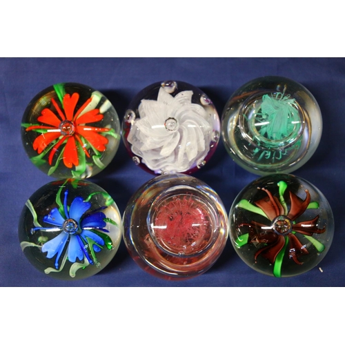 36 - Six glass paperweights.