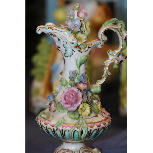 120 - Continental porcelain floral encrusted ewer, 15cm, and a similar scent bottle, both indistinctly mar... 