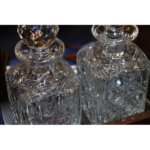 129 - Two decanter tantalus.