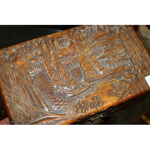 12 - Miniature heavily carved oriental camphorwood trunk, 30cm wide.