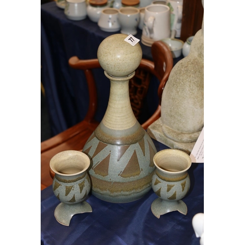 77 - Studio Pottery decanter and two matching goblets.  (a/f)