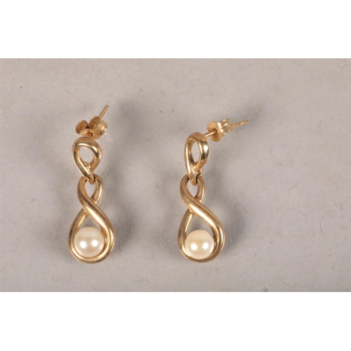 68 - Pair of 9 carat yellow gold and pearl set earrings; 2.1g gross weight