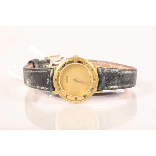 79 - Ladies yellow metal cased Gucci wristwatch; with black Roman numerals; marks verso