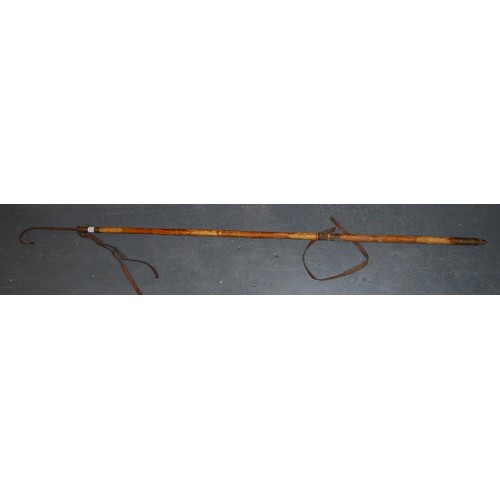 197 - Fishing interest: Hardy Bros fishing gaff with brass mounts and carry strap, a Hardy Bros bamboo rod... 