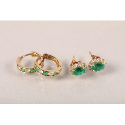 112 - Two pairs of 9 carat yellow gold and emerald set earrings; 1.8g gross weight