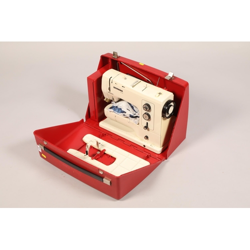Cased Bernina 830 sewing machine accessories; together with a tin