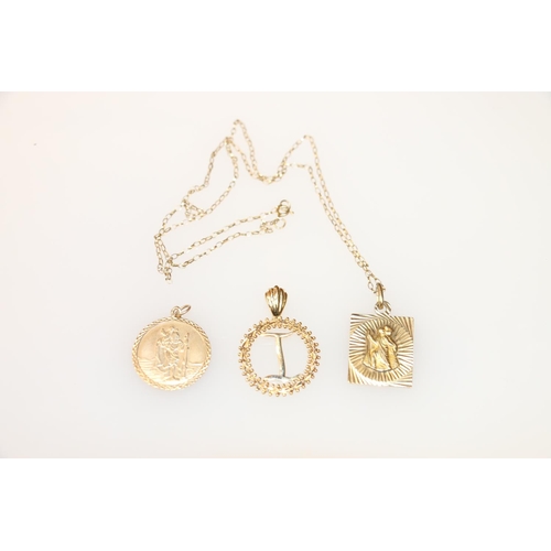 149 - 14k gold pendant in form of initial I within a wreath, 3cm, two 9k gold pendants depicting St. Chris... 