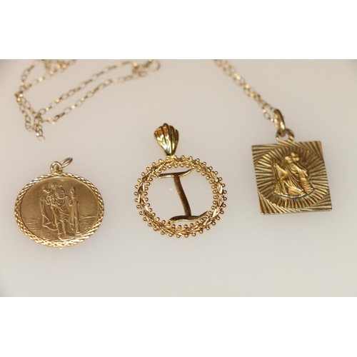 149 - 14k gold pendant in form of initial I within a wreath, 3cm, two 9k gold pendants depicting St. Chris... 