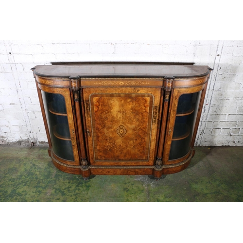 584 - Late 19th century figured walnut credenza, the bow front cabinet with large door to the centre, flan... 