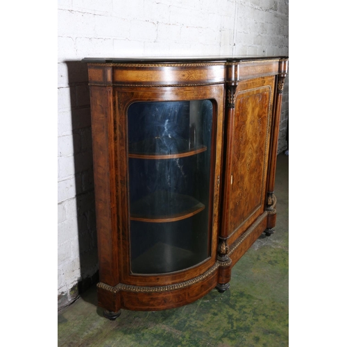 584 - Late 19th century figured walnut credenza, the bow front cabinet with large door to the centre, flan... 