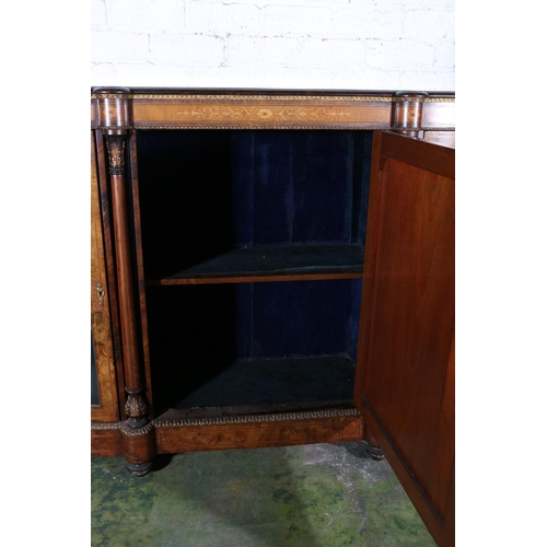 584 - Late 19th century figured walnut credenza, the bow front cabinet with large door to the centre, flan... 