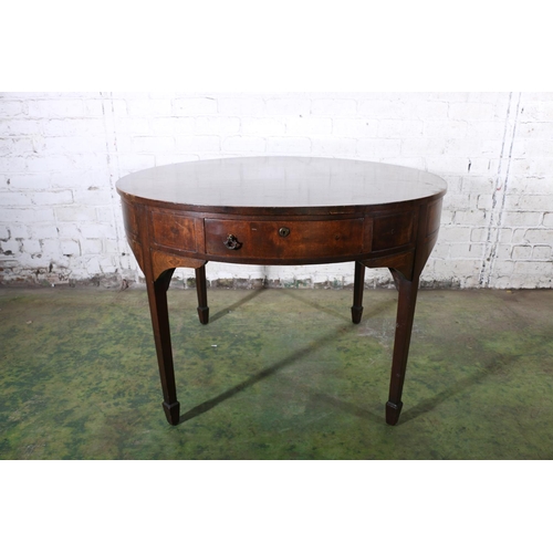 590 - Antique mahogany drum dining table, the circular top above frieze with four drawers, raised on squar... 