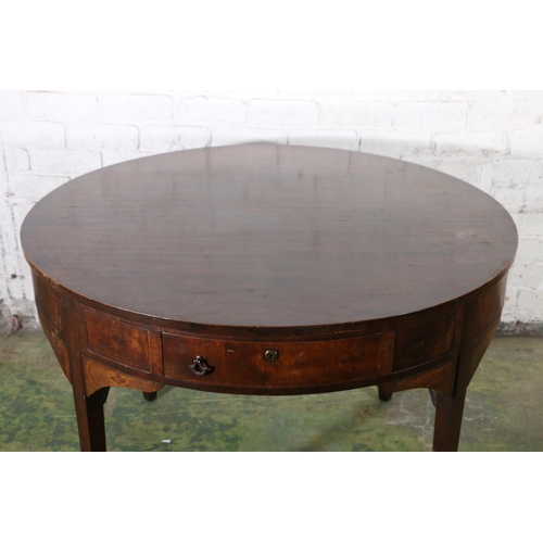 590 - Antique mahogany drum dining table, the circular top above frieze with four drawers, raised on squar... 