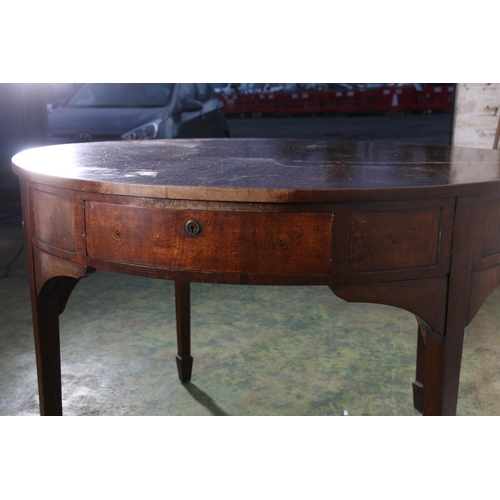 590 - Antique mahogany drum dining table, the circular top above frieze with four drawers, raised on squar... 