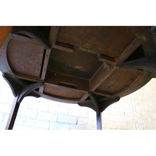 590 - Antique mahogany drum dining table, the circular top above frieze with four drawers, raised on squar... 