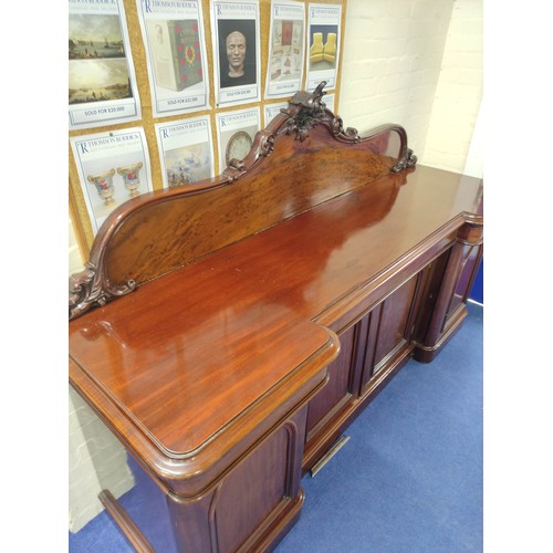 607 - Victorian mahogany reverse breakfront sideboard, foliate scroll raised back above frieze drawers and... 