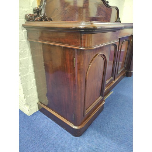 607 - Victorian mahogany reverse breakfront sideboard, foliate scroll raised back above frieze drawers and... 