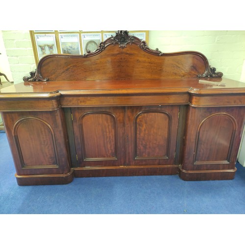 607 - Victorian mahogany reverse breakfront sideboard, foliate scroll raised back above frieze drawers and... 