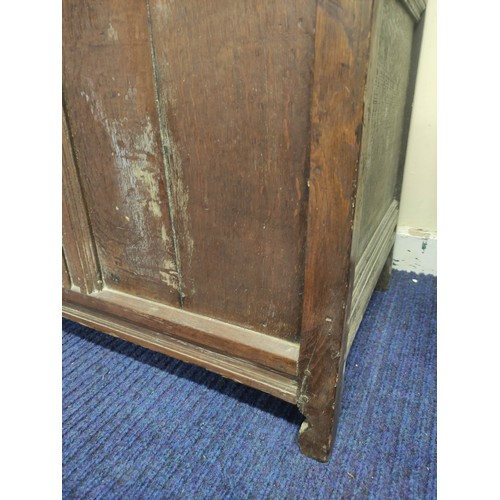 611 - Antique oak cupboard, moulded pediment above pair of triple panel doors on panelled box base and sti... 