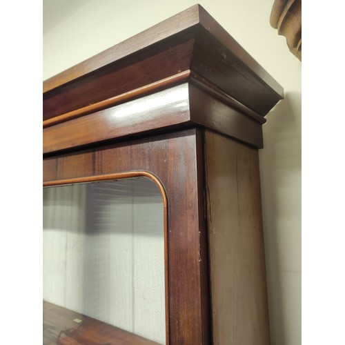 612 - Late 19th century mahogany and beech cabinet bookcase, the glazed upper section above lower section ... 