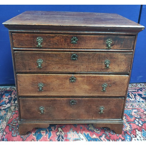 618 - 18th century oak chest of four graduated drawers, moulded edge top and drop handles on bracket feet,... 