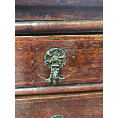 618 - 18th century oak chest of four graduated drawers, moulded edge top and drop handles on bracket feet,... 