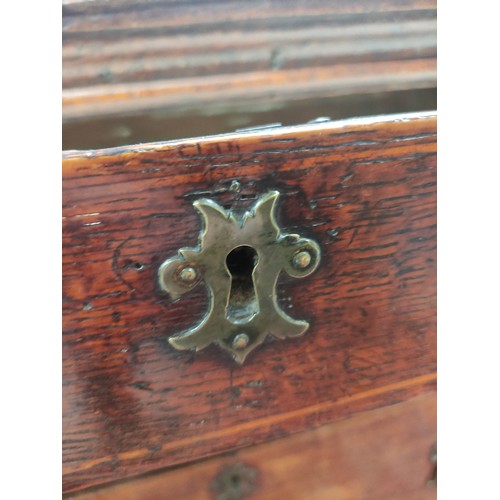 618 - 18th century oak chest of four graduated drawers, moulded edge top and drop handles on bracket feet,... 