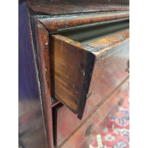 618 - 18th century oak chest of four graduated drawers, moulded edge top and drop handles on bracket feet,... 